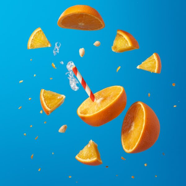 sliced orange fruit on blue surface